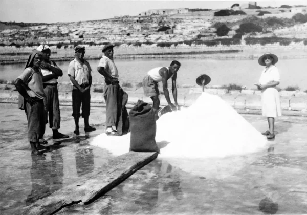 Mrs Clarke at the salt pans with the workers.