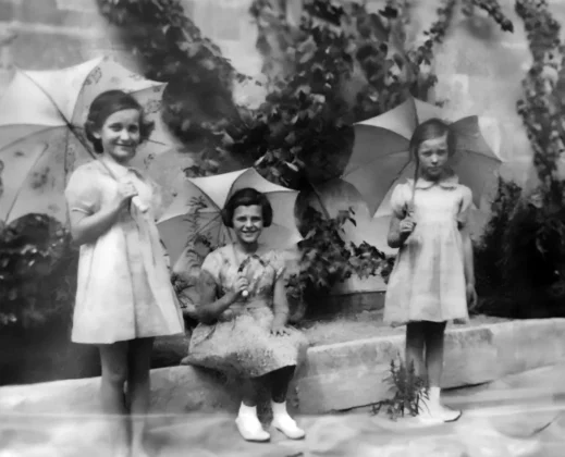 Parasols for the hot sun, Hong Kong, early 1937: Joan (5), Margaret (7), Daphne (5).